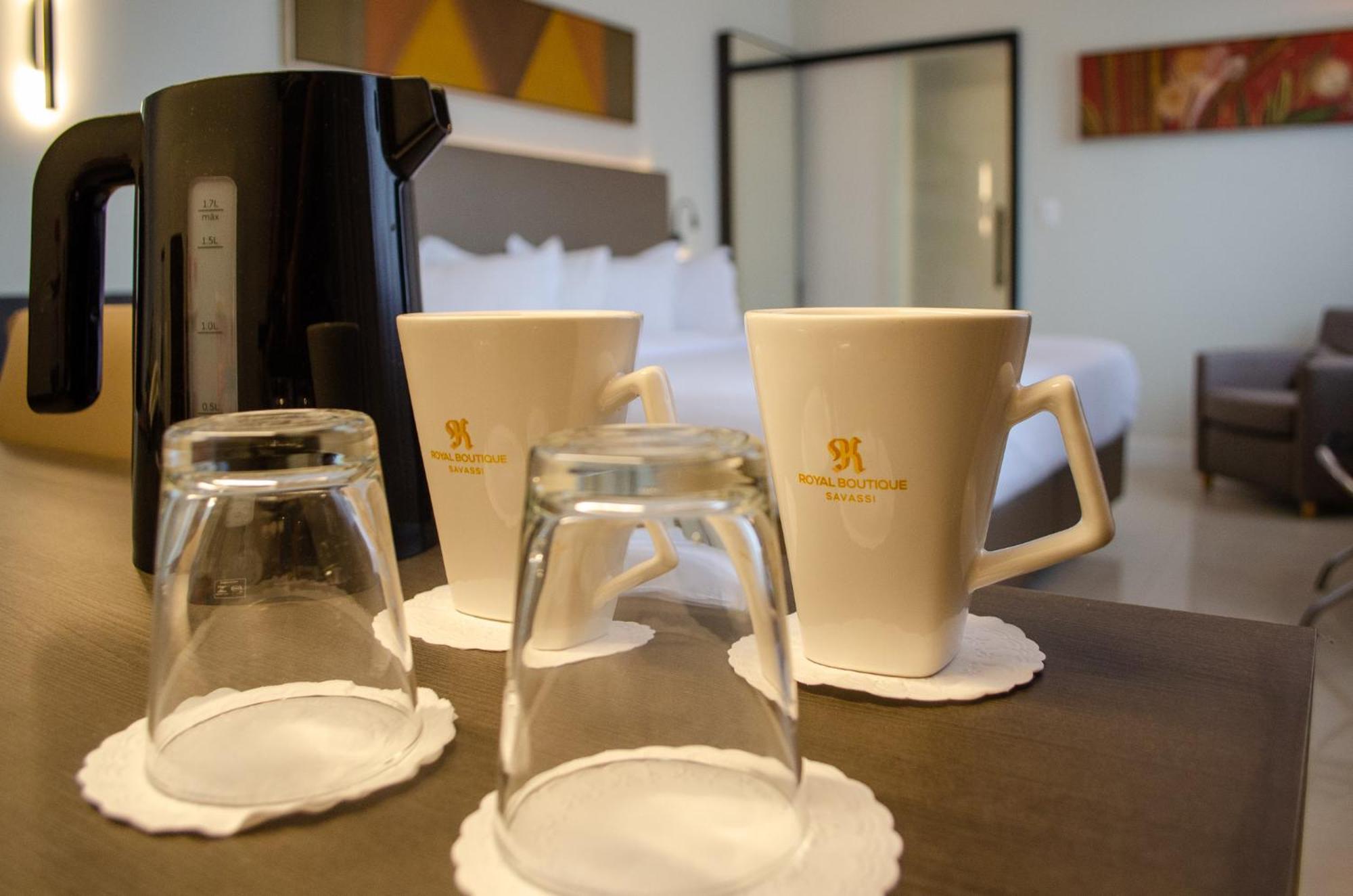 Royal Boutique Savassi Hotel Belo Horizonte Eksteriør billede A coffee pot and two cups